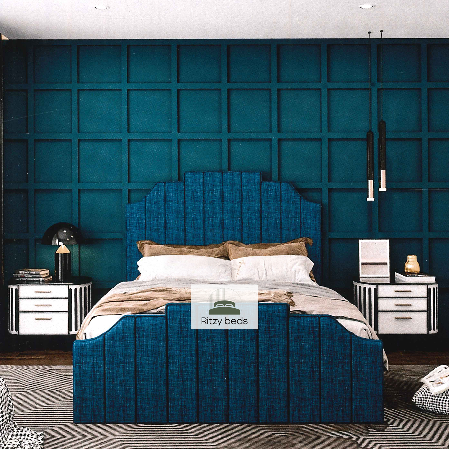 Blue fluted handmade upholstered bed in a bedroom with a textured teal wall.
