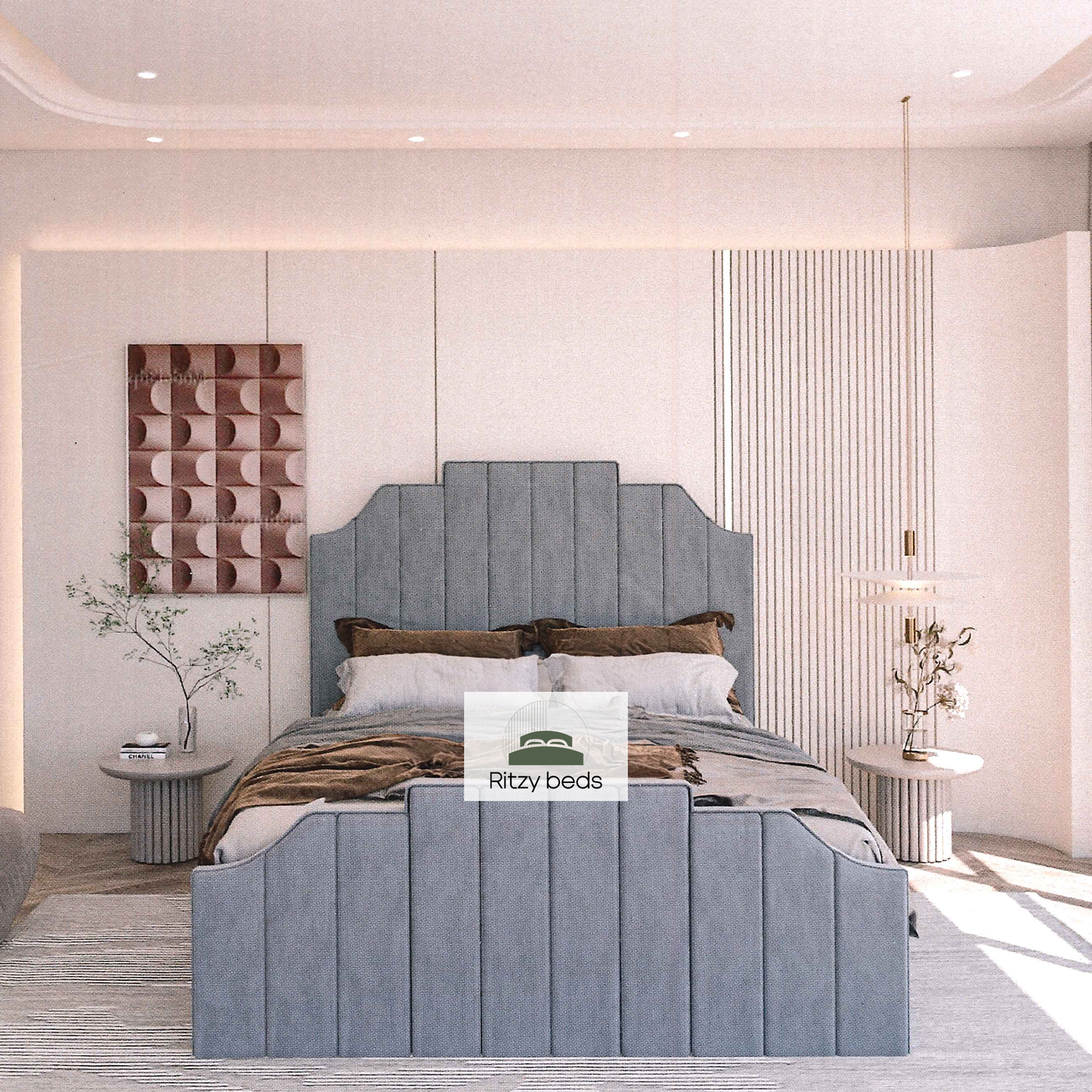 Modern bedroom with a gray fluted upholstered bed and 'Ritzy Beds' logo.