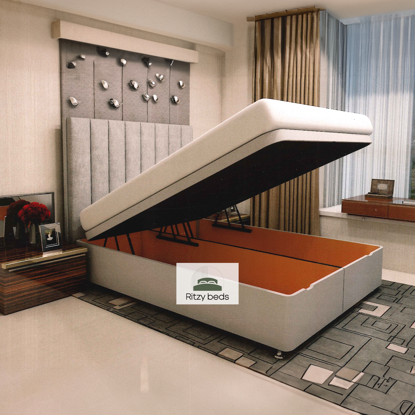 Gray upholstered bed with ottoman storage compartment in a modern bedroom, featuring the 'Ritzy Beds' brand.