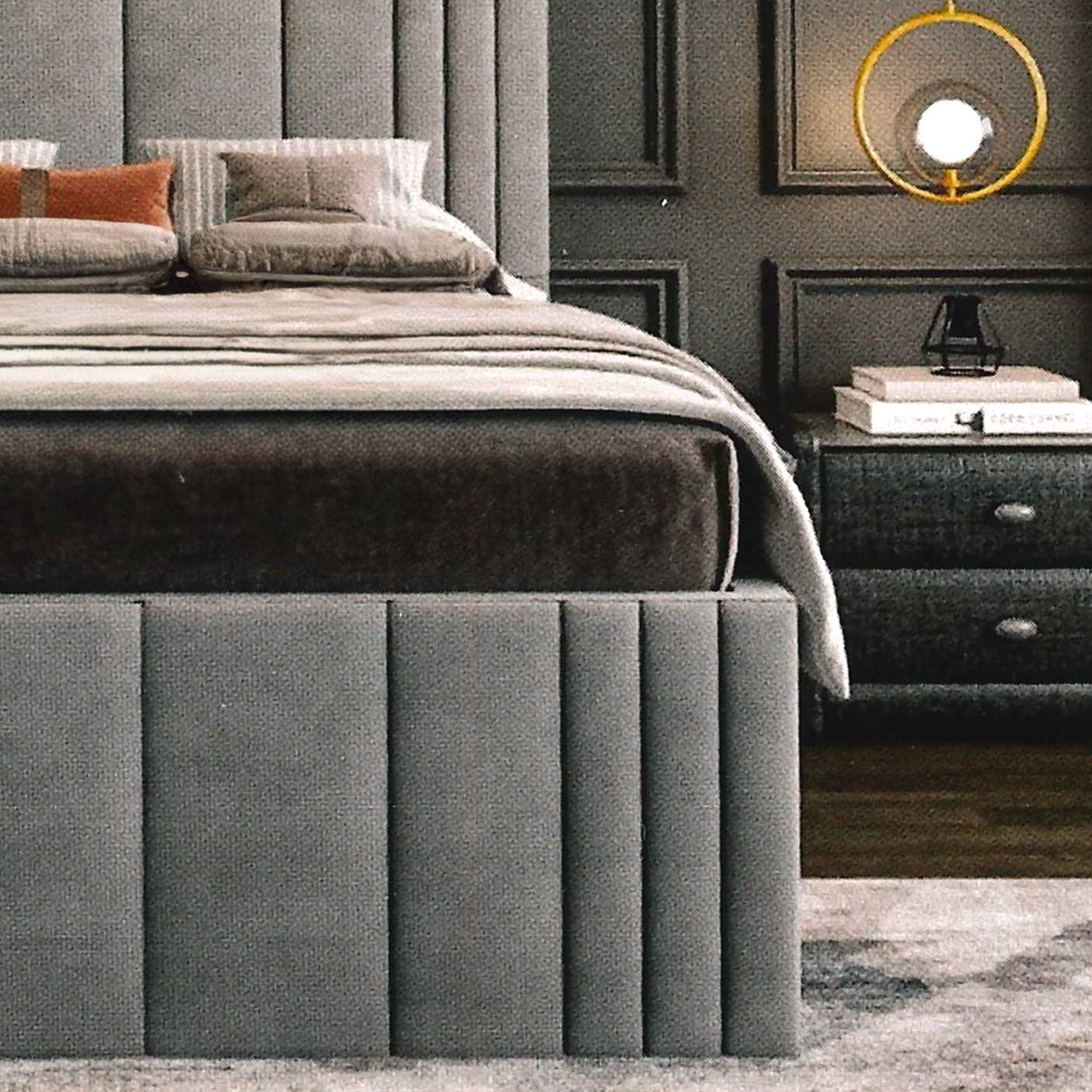 Gray luxury upholstered bed with matching footboard in a bedroom setting.