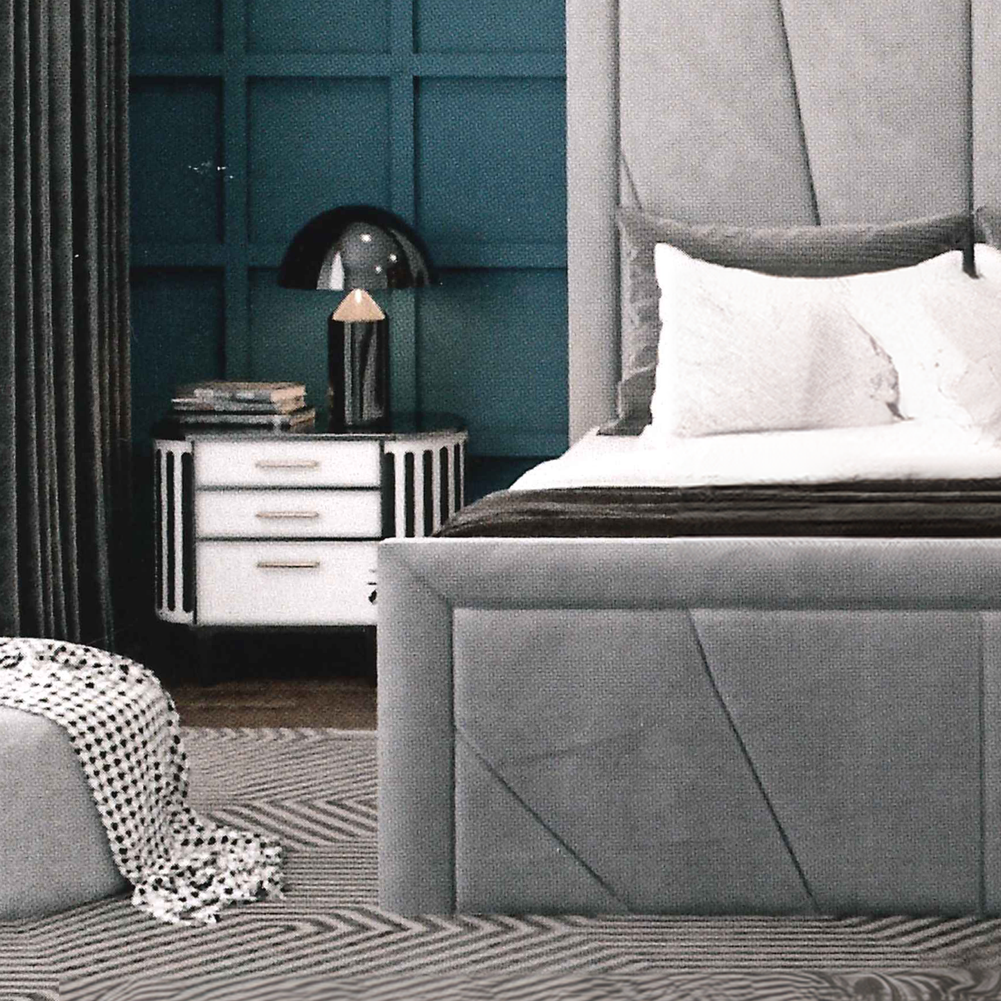 Gray upholstered bed in a bedroom with a teal paneled wall and a nightstand.