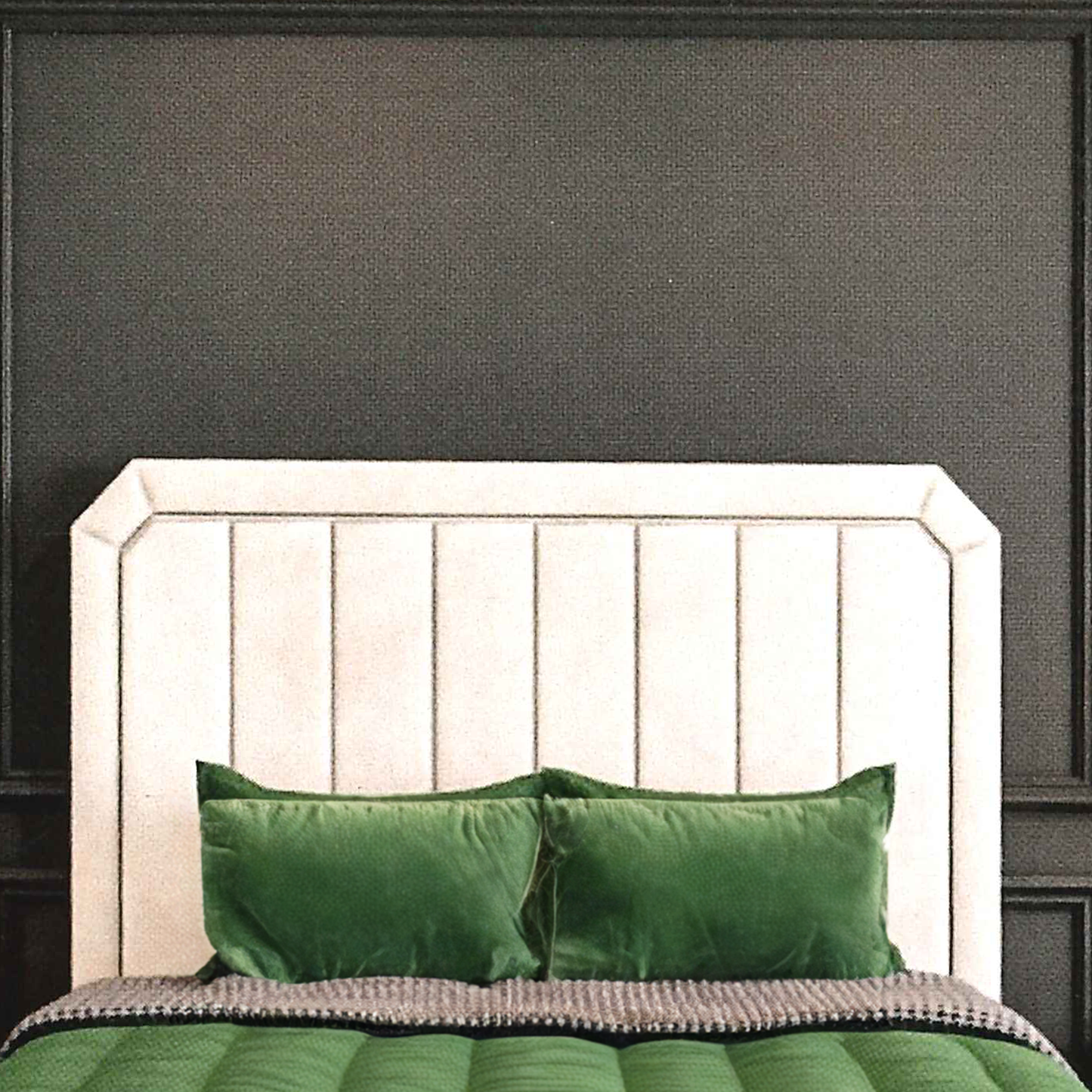 Beige upholstered headboard with green bedding against a dark paneled wall
