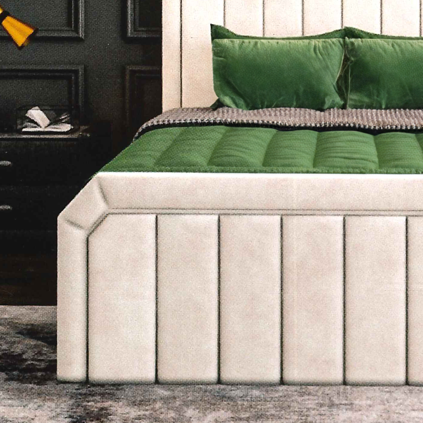 Beige upholstered bed with green mattress and pillows in a bedroom setting.