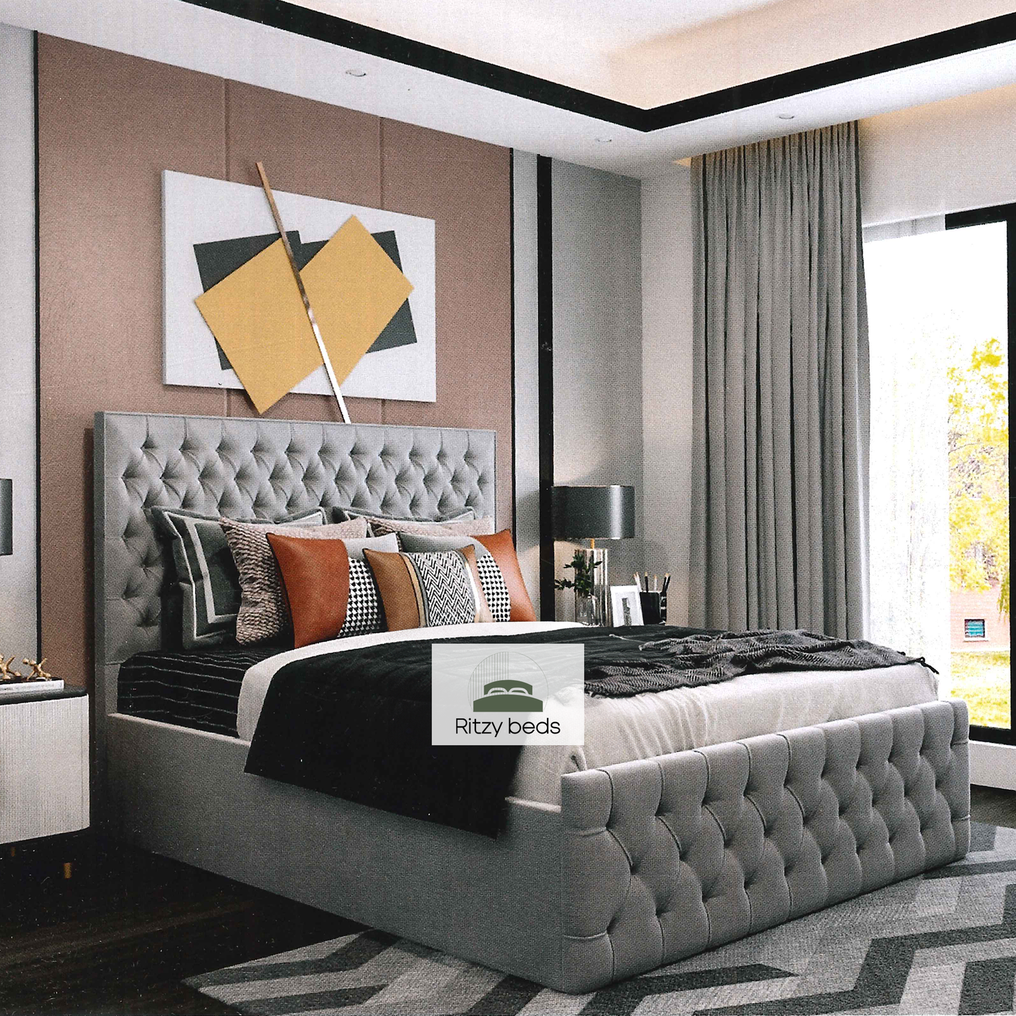 Gray tufted handcrafted bed with decorative pillows in a modern bedroom setting, featuring the 'Ritzy Beds' brand.