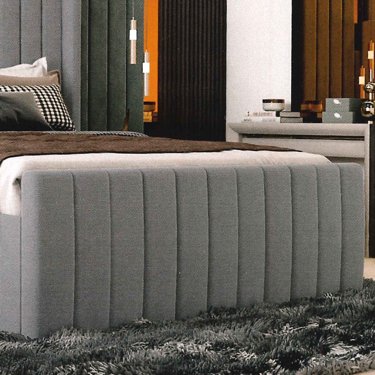 Gray upholstered bench in a room with decorative elements