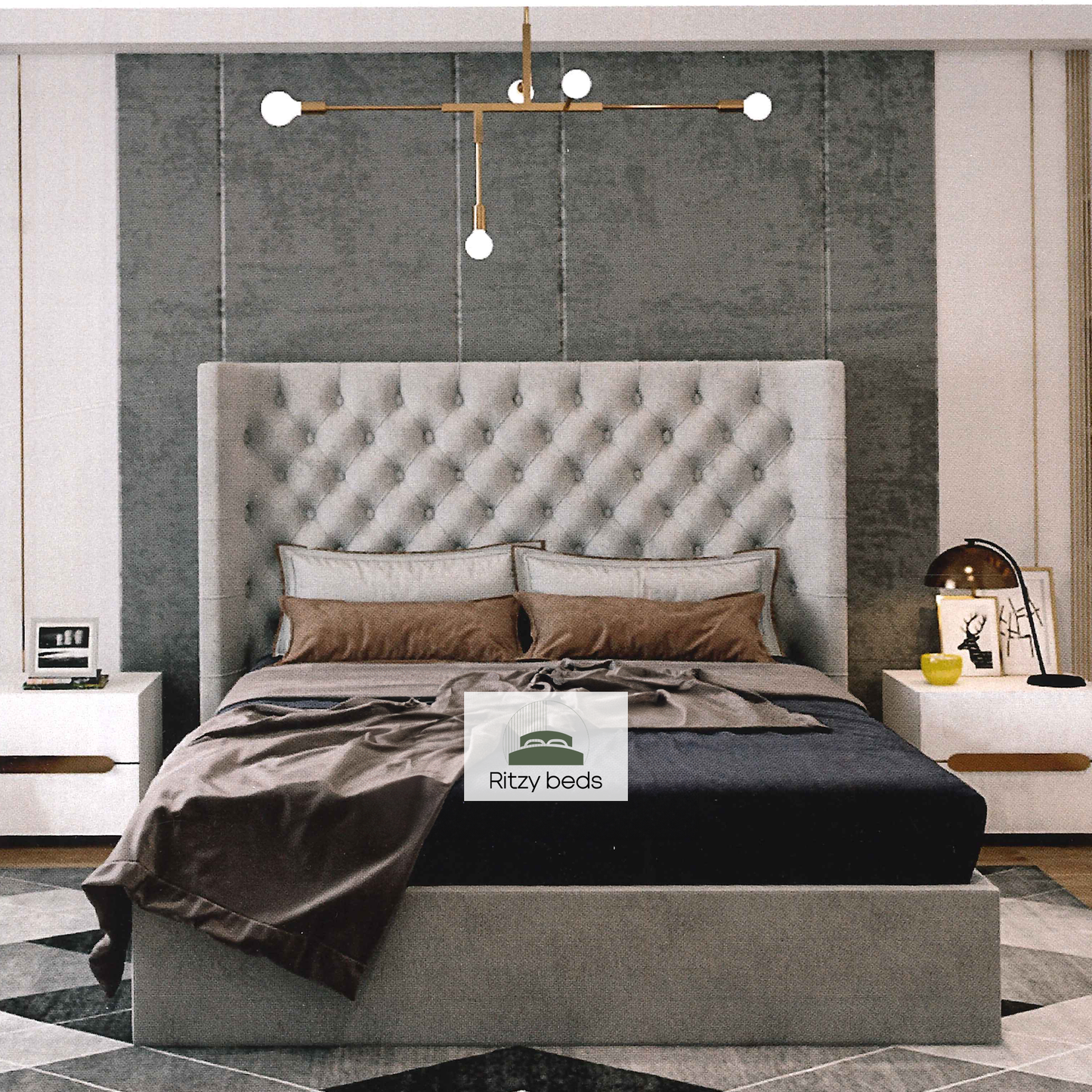 Gray upholstered bed with tufted headboard in a modern bedroom setting, featuring the 'Ritzy Beds' brand.