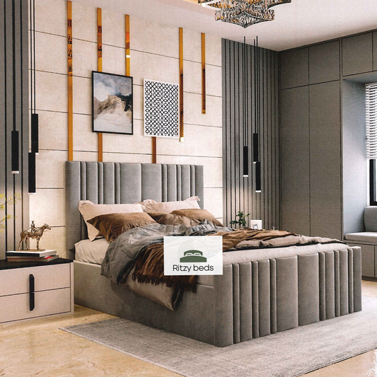 Modern bedroom with a gray handmade bespoke upholstered bed and decorative elements, featuring the Ritzy Beds logo.