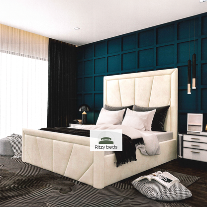 Modern bedroom with a beige angular geometric handmade british upholstered bed and dark blue wall.