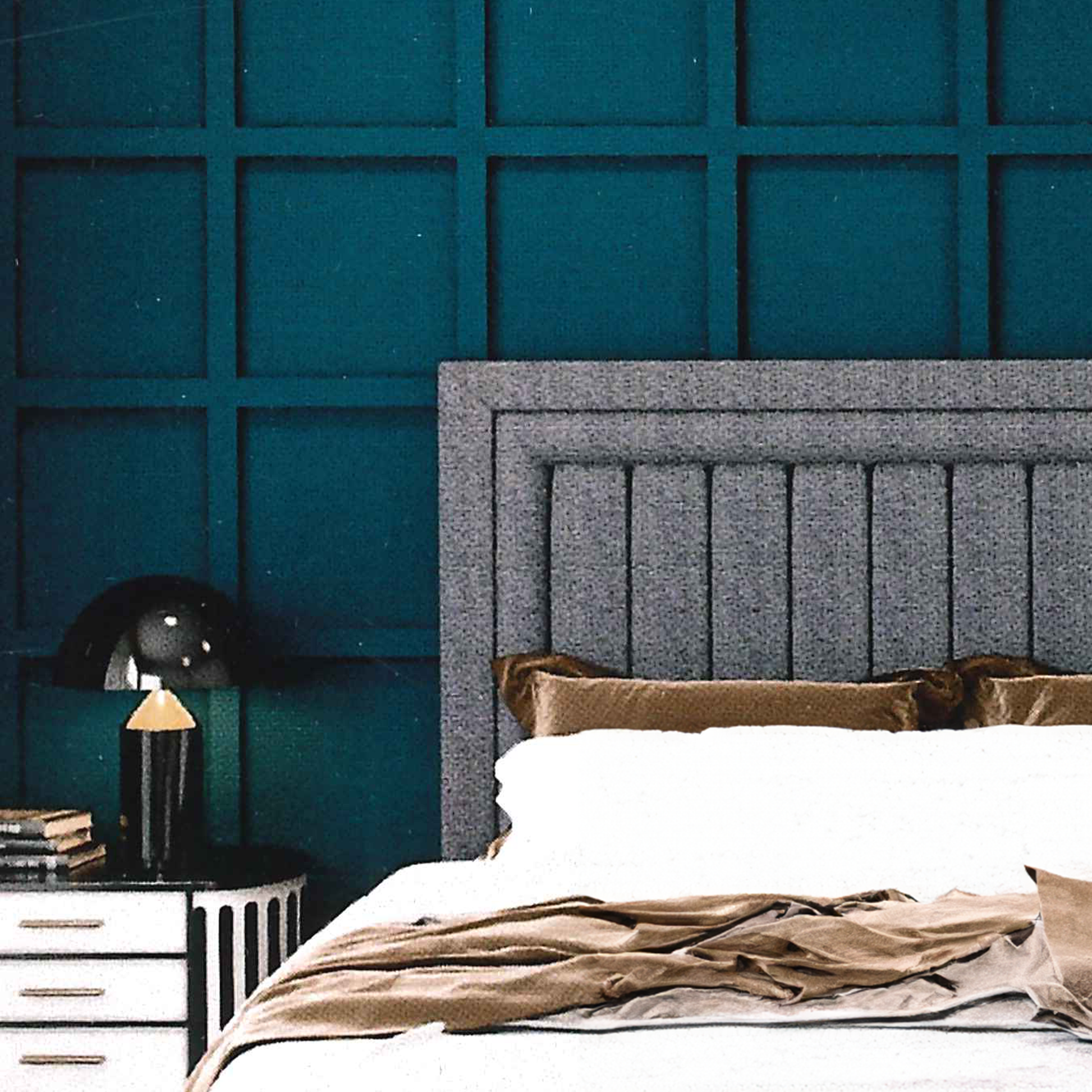 Bedroom with a textured teal wall and gray upholstered headboard luxury.