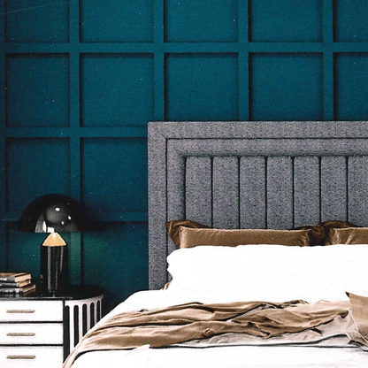 Bedroom with a textured teal wall and gray upholstered headboard luxury.