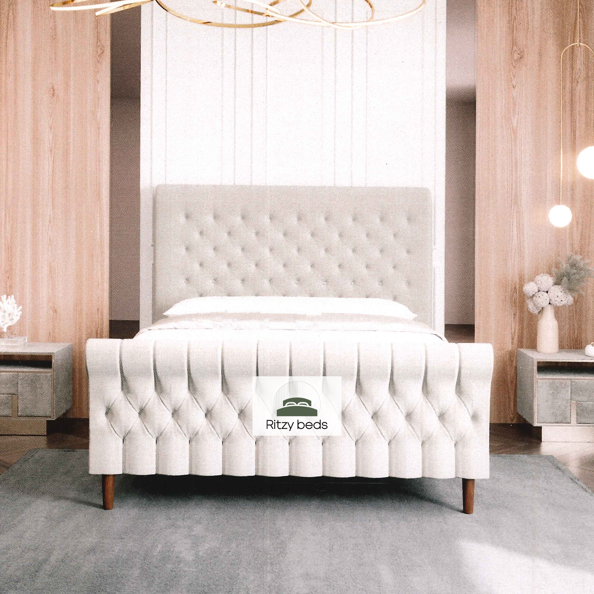 White tufted scroll luxury bed with 'Ritzy beds' logo in a bedroom setting